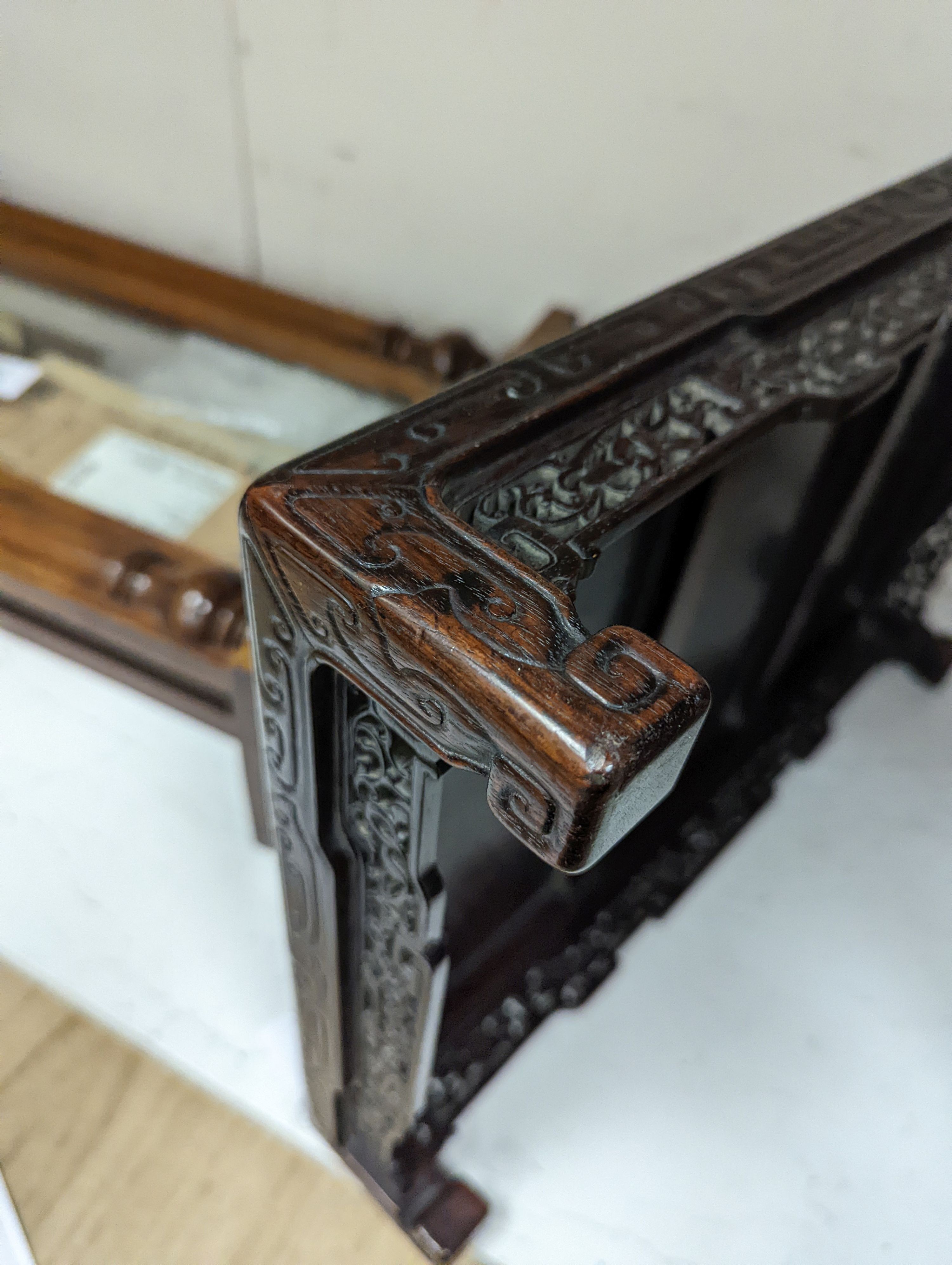 A 19th century Chinese hongmu low stand - 51cm long